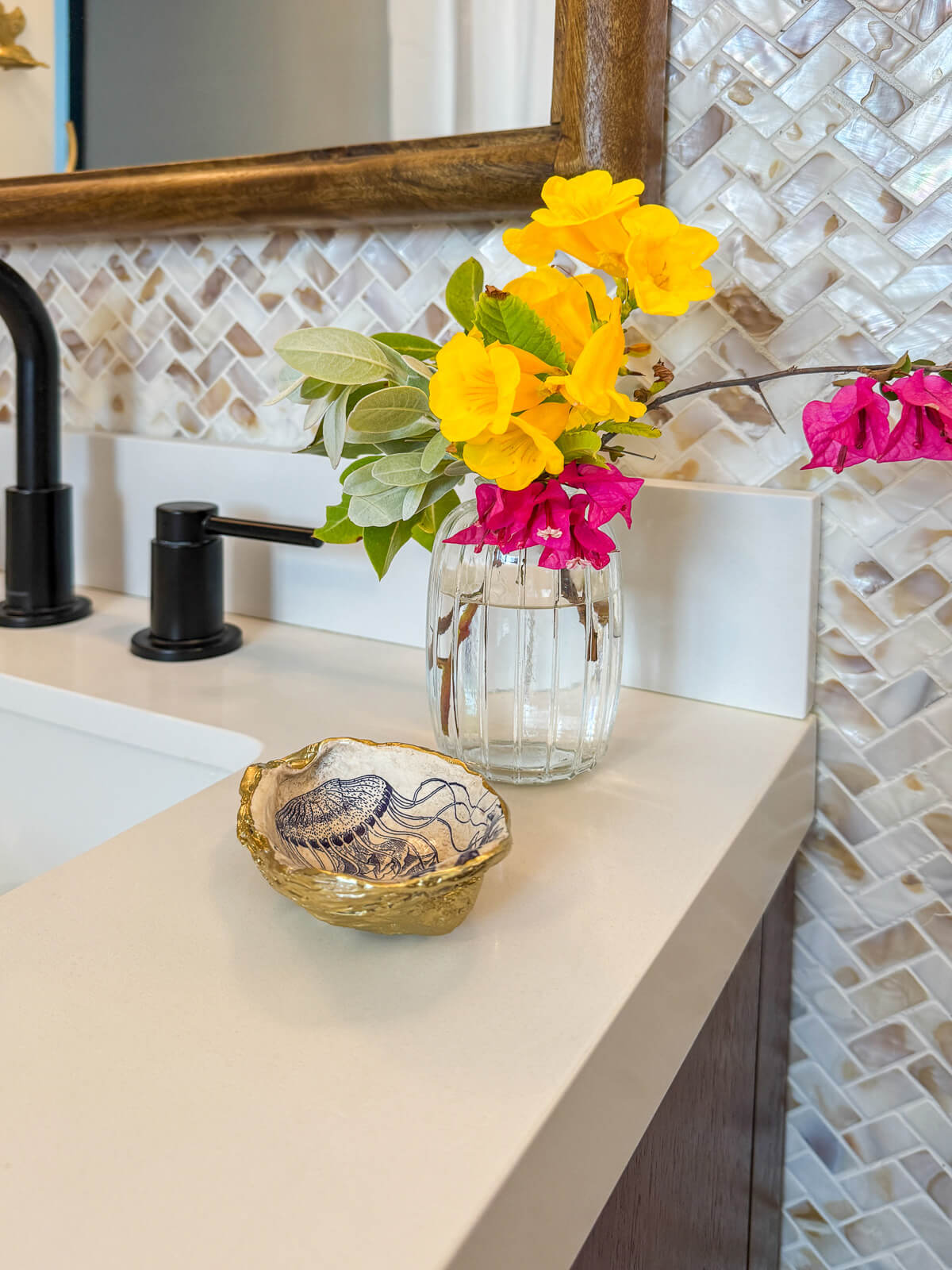 Downstairs shared bathroom — two full vanities, newly renovated, clean coastal finishes