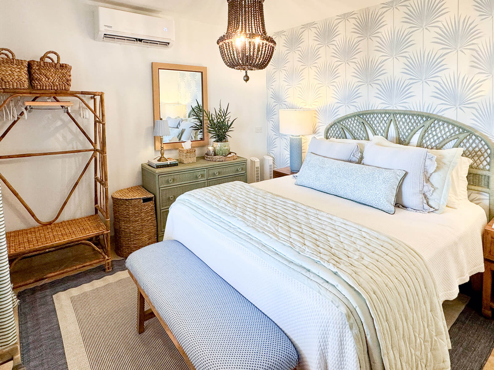 Palm Haven bedroom — soft palm patterns, warm natural tones, ocean view of St. Martin