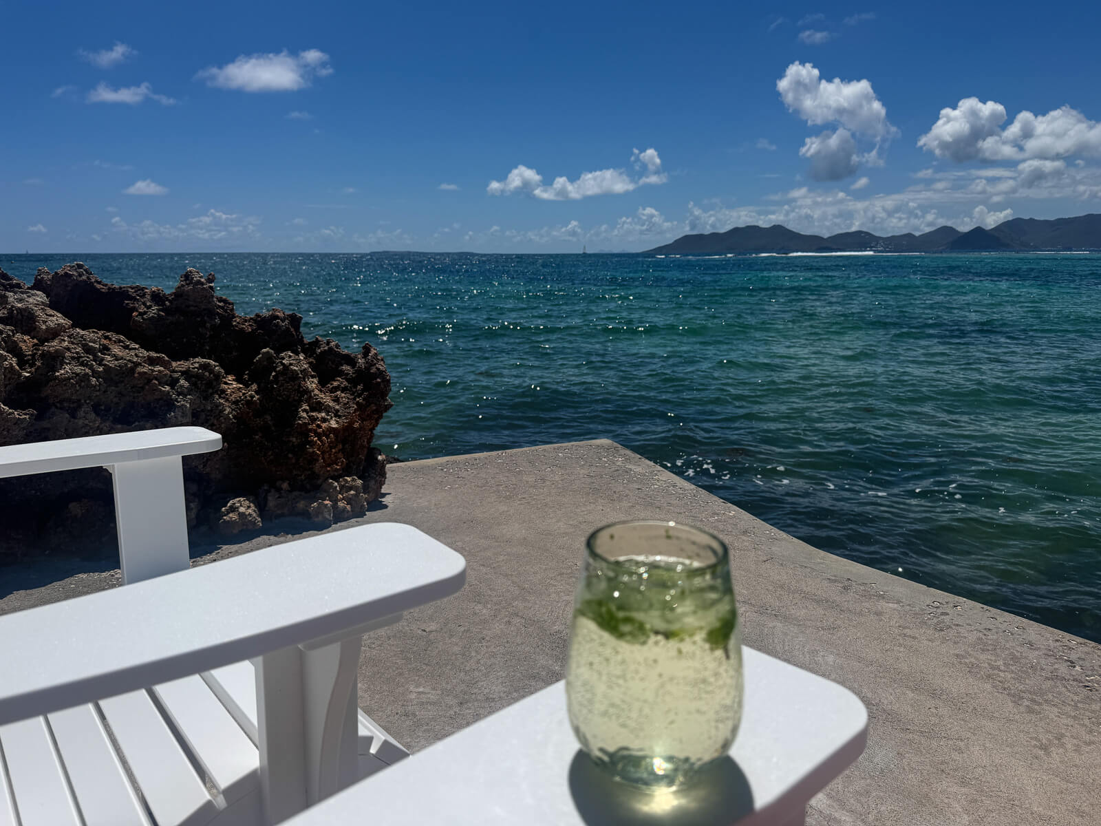 The Dock — ocean stretching out toward the horizon