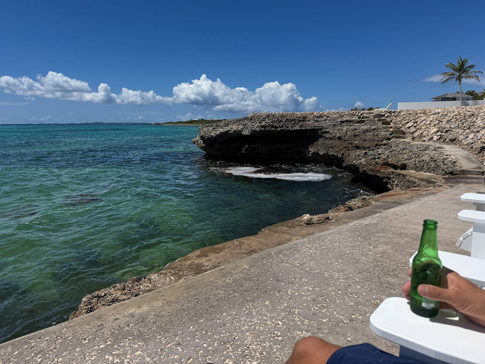 The Dock — clear turquoise water below, reef visible