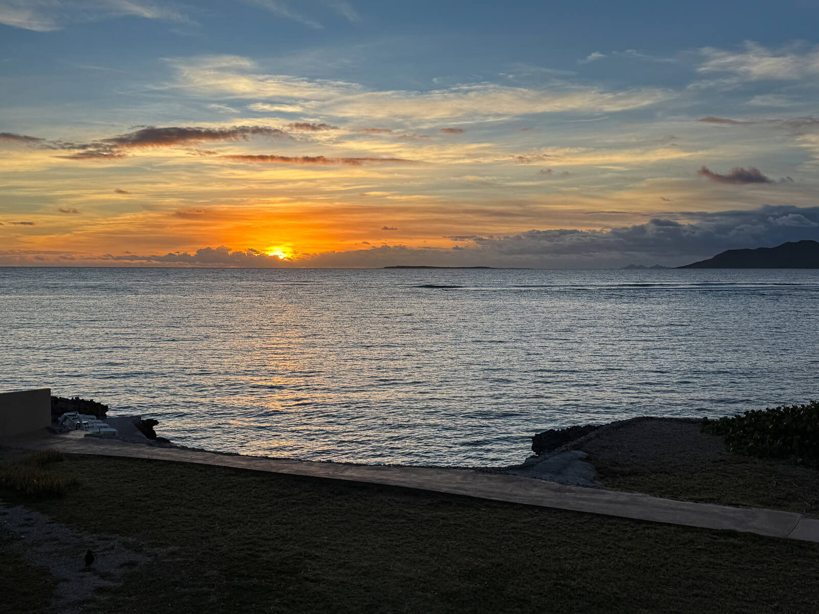 The Dock — sunrise over the water, best seat on the property