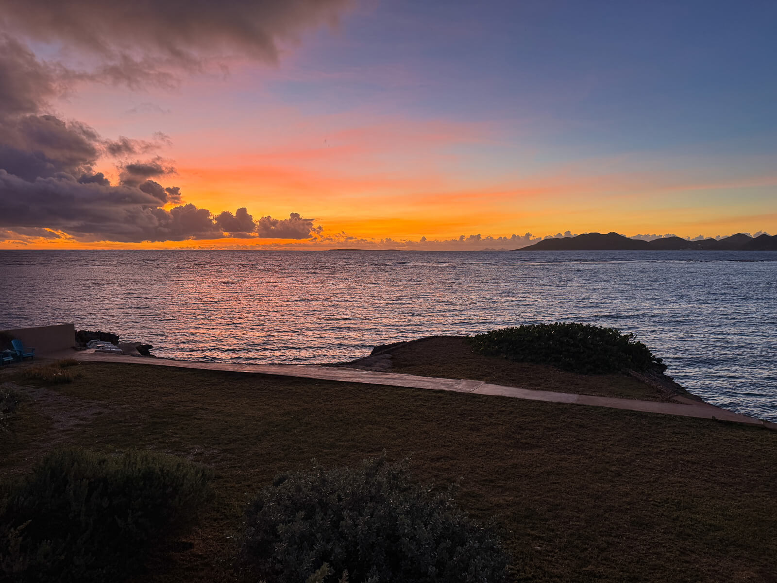 The Dock — calm Caribbean water, St. Martin on the horizon